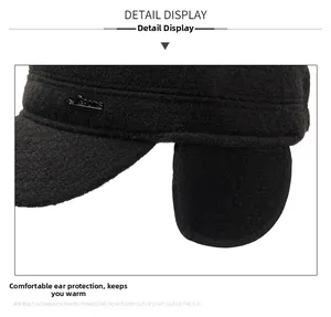 Detail view of winter flat cap with thick wool fabric and foldable ear protection flap