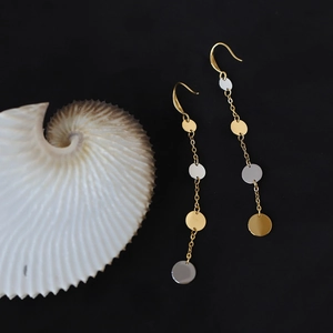 Long dangle earrings with gold and silver round discs on chains with hook fastening