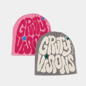 Close-up of jacquard knit beanie featuring GRUY VISIONS lettering and star patterns