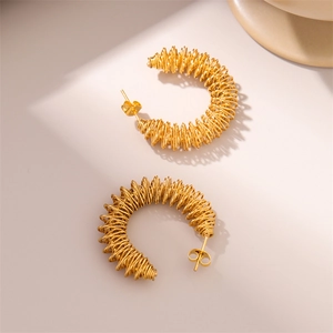 Modern gold spiral twist earrings in stainless steel with a minimal geometric design