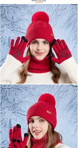 Detail view of red knitted touch-screen gloves with non-slip palm for winter warmth