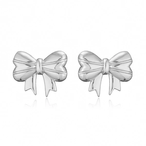 Macro shot of silver bow stud earrings with a smooth polished finish and clear reflections