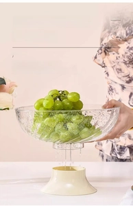 Detail of a transparent textured fruit plate with a detachable cream draining base