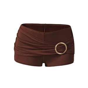 Detail of dark brown high-stretch swimwear shorts featuring a decorative gold metal ring