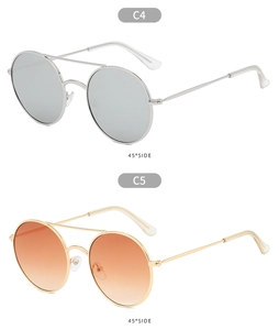 Detail view of double bridge metal sunglasses in silver mercury and orange gradient lenses