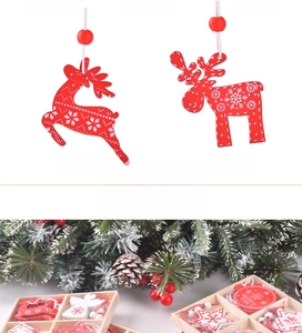 Detailed view of DIY wooden Christmas tree ornaments with elk and star patterns in a box