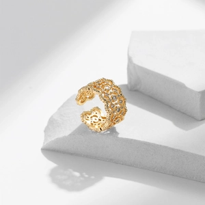 Luxurious 18K gold plated wide open ring with zircon inlay and hollow pattern on white block