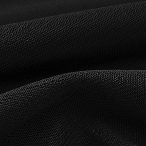 Macro détaillée de la texture du tissu en maille fine noire avec un drapé élégant et doux