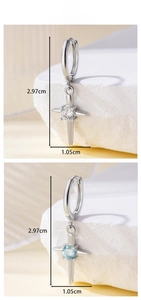 Detailed size view of cross star pendant earrings with white and blue cubic zirconia stones