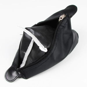 Close-up of black PU leather makeup bag with zipper and handle on white background