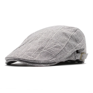 Grey checkered linen newsboy cap with adjustable metal side buckle and textured fabric