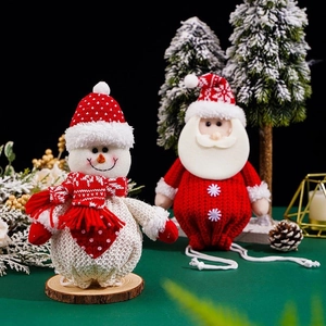 Knitted Christmas gift bags featuring 3D Santa and snowman characters for holiday decor