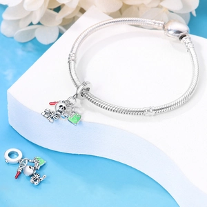 Detail of silver snake chain bracelet with skull charms holding heart and love pendants