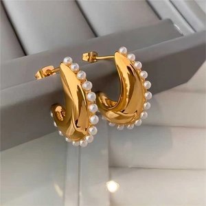 Vintage golden C-shaped stainless steel earrings with elegant white pearl accents