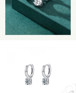 Macro shot of silver S925 earrings featuring brilliant round-cut cubic zirconia stones