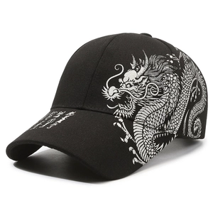 Black baseball cap with silver dragon print and artistic calligraphy in a 45-degree side view