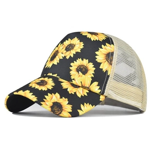 Women's trucker hat with sunflower pattern and beige mesh back for high ponytail