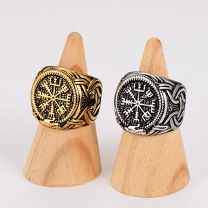 Vintage Viking compass rings in gold and silver finish on wooden jewelry stands