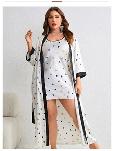 Detail of the black satin trim on the white plus size robe with colorful heart print