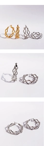 Detailed macro view of wavy snakeskin texture earrings in gold and silver finish