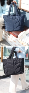 Gesteppte Tragetaschen aus Nylon in Dunkelblau und Schwarz an einem Modell