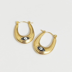 Gold U-shaped hoop earrings featuring a polished finish and black evil eye enamel charms