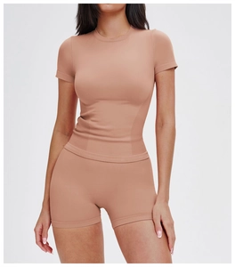 Detail of high-stretch ribbed fabric on seamless yoga crop top and high-waist shorts set