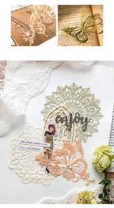 Detailed laser-cut paper scrapbooking material with floral and butterfly patterns
