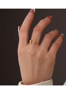 Detailed close-up of a golden bee-shaped adjustable ring featuring intricate insect wing details
