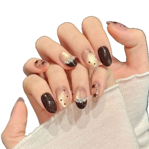 French Brown Maillard cat-eye press-on nails with stars, polka dots and rhinestones