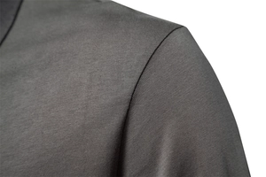 Macro shot of charcoal grey knitted cotton fabric with high-density shoulder stitching