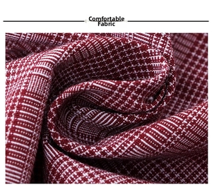 Close-up of premium red and white plaid cotton fabric showing woven texture and softness
