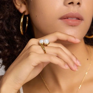 Minimalist double pearl stainless steel open ring shown on model with gold finish