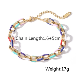 Detailed macro view of colorful enamel drops on a gold-plated stainless steel cuban chain