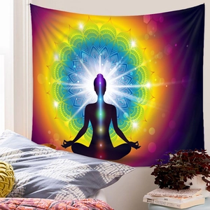Detail of colorful Seven Chakra Mandala tapestry hanging in a cozy bedroom setting