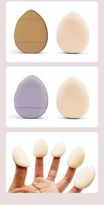 Macro view of teardrop makeup sponges and finger puff applicators in multiple colors