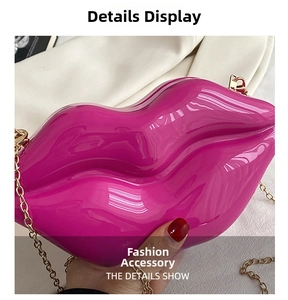 Detailed close-up of rose red lip-shaped acrylic clutch with gold chain strap