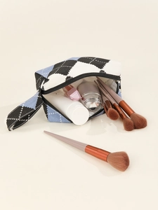 Detail of checkered canvas cosmetic bag featuring a secure zipper and side handle strap