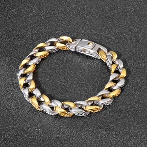 Two-tone silver and gold Cuban link chain bracelet with vintage floral side engraving