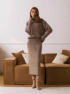 Women's two-piece knit set featuring a brown turtleneck sweater and long straight skirt
