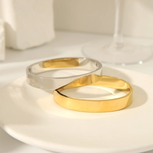 Polished 18K gold and silver plated titanium steel bangles in minimalist mirror finish