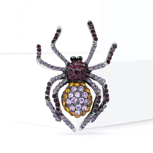 Vintage alloy spider brooch with colorful rhinestones on a clean white background
