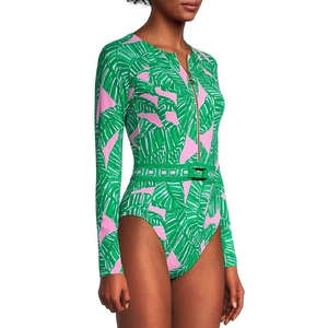 Detail view of long-sleeve palm print surfboard swimsuit with front zipper and belt