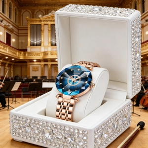 Detail of luxury rose gold watch with blue faceted glass dial and sparkling gift box