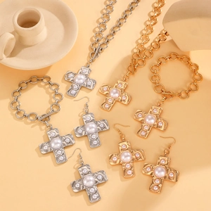 Golden and silver spiral cross jewelry set including necklace, bracelet and earrings with pearls