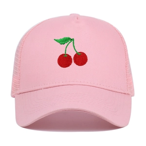Detailed close-up of pink trucker hat featuring red cherry embroidery and breathable mesh