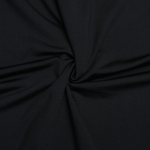 Vue macro de la texture du tissu noir élastique avec reflet et drapé élégant