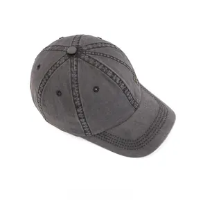 Detail view of washed cotton baseball cap with ventilation eyelets and top button