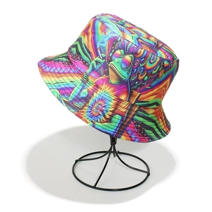 Close-up of vibrant psychedelic frog print on a bucket hat displayed on a black metal stand
