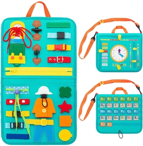 Detail view of Montessori busy board with zippers, buckles, and learning clock for toddlers